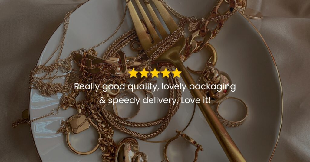 A white plate overflowing with gold chains, rings, and a gold fork, with a five-star review and the text "Really good quality, lovely packaging & speedy delivery. Love it!"