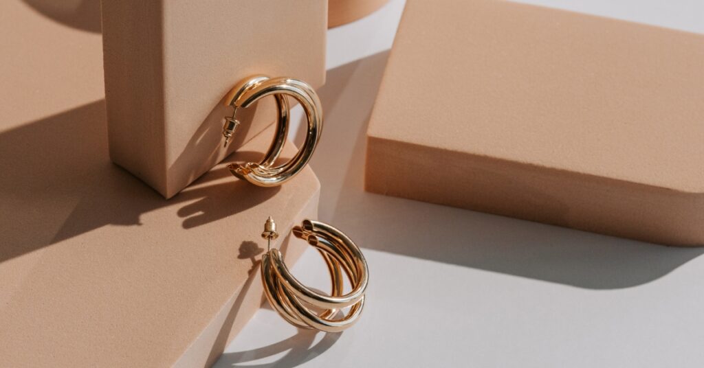 Elegant gold hoop earrings with a layered design, perfect for a sophisticated look.