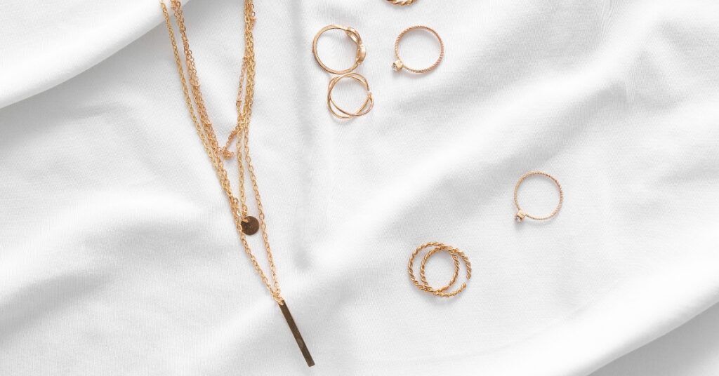 Elegant gold necklace and rings, ideal for adding a touch of luxury to any outfit.