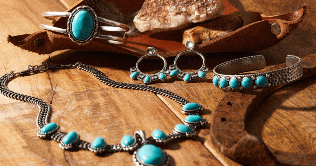 Collection of turquoise jewelry pieces, including a necklace, earrings, bracelets, and a pendant.