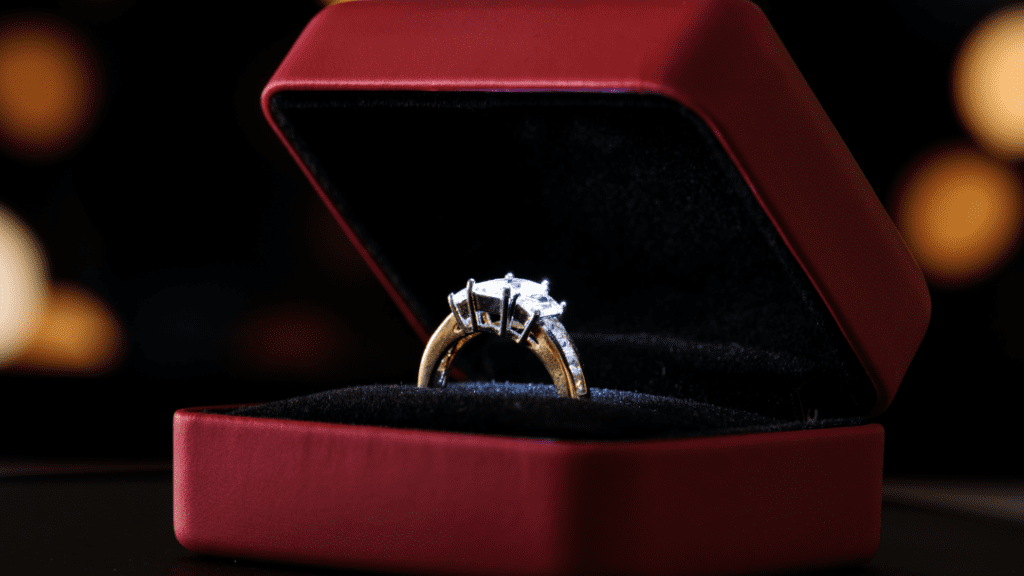 Romantic engagement ring nestled in a plush red box, perfect for a special occasion.