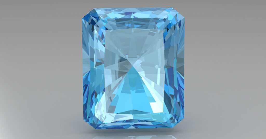 A dazzling rectangular-cut aquamarine gemstone, showcasing a brilliant icy blue color with sharp facets and reflective surfaces against a neutral background.