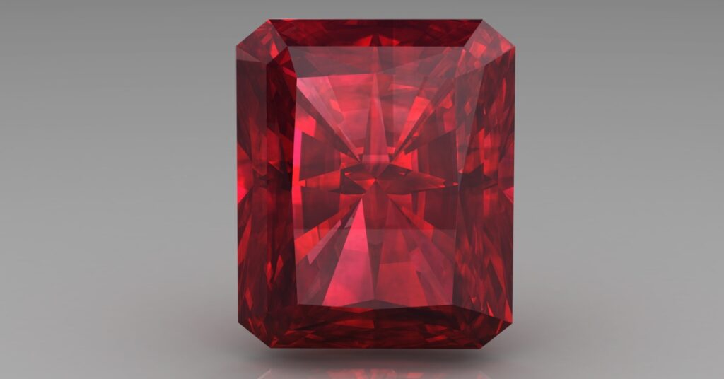 Stunning ruby gem in an emerald cut, highlighting its deep red hue and luxurious appearance.