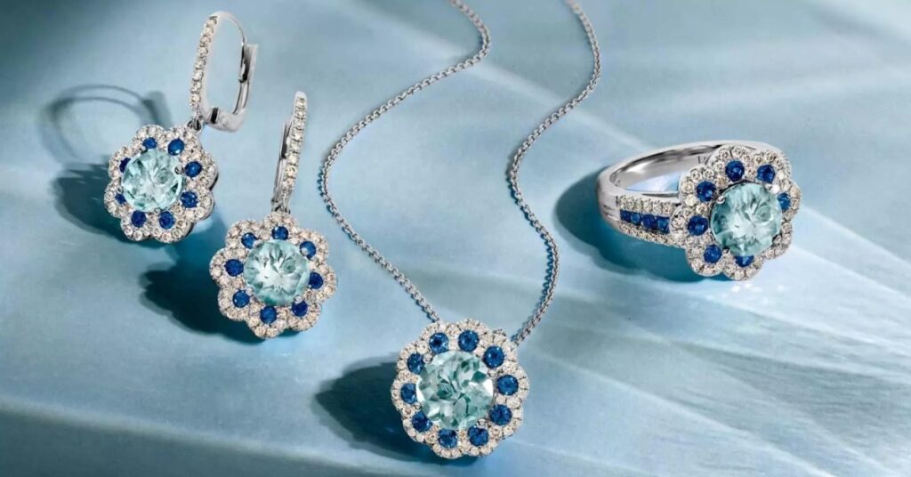  A set of sapphire and diamond jewelry including a ring, necklace, and earrings.