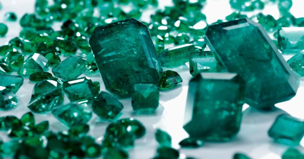 Emerald stones with a translucent quality and a vibrant green color.