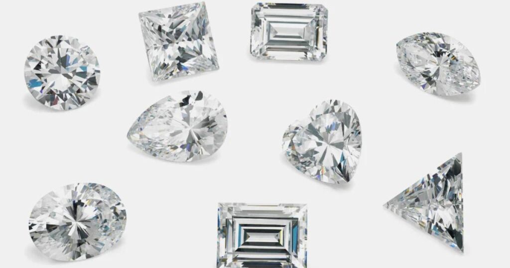 Assorted diamond shapes including round, princess, emerald, pear, oval, heart, marquise, Asscher, and trillion, each cut showcasing unique facets.