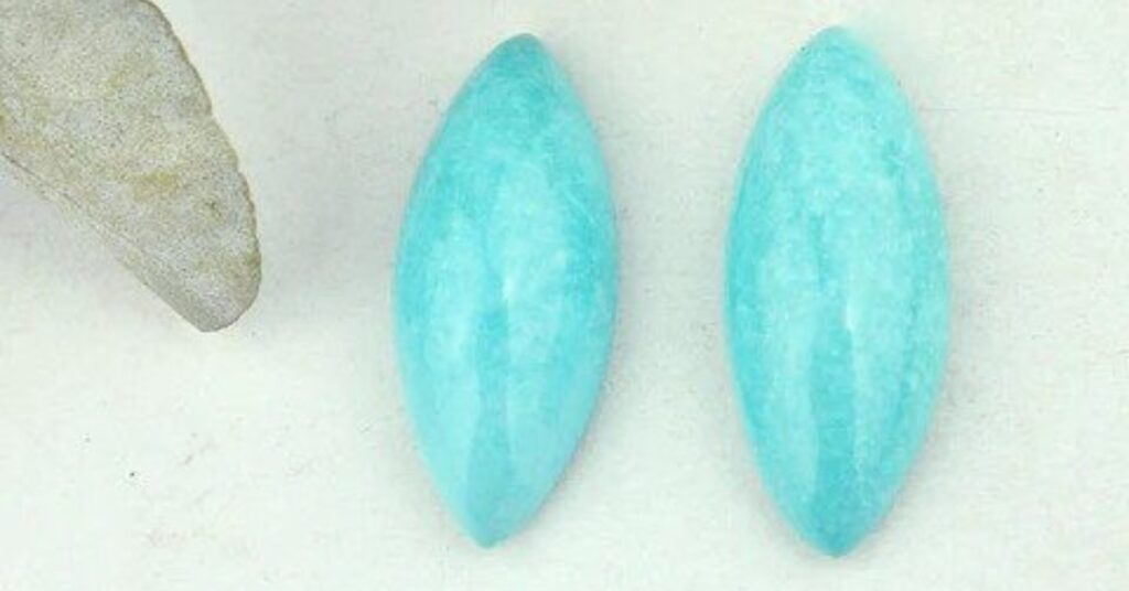 A pair of marquise-cut amazonite gemstones with a light blue color.