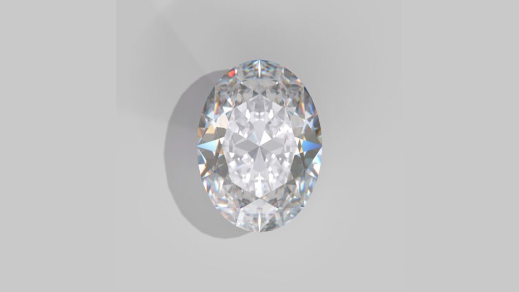 A sparkling oval-shaped diamond, casting a colorful shadow on a white background.