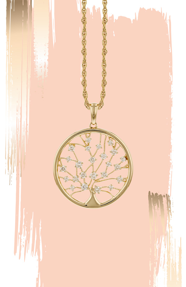 A gold necklace with a circular pendant featuring a tree of life design with diamond accents, set against a pink background with gold brushstrokes.