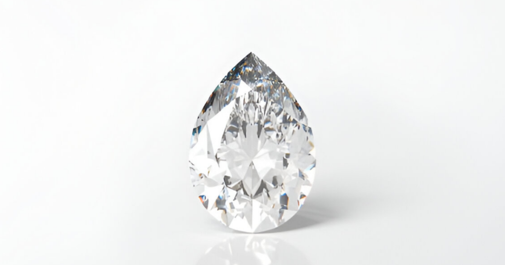 A sparkling pear-shaped diamond, reflecting light on a white background.