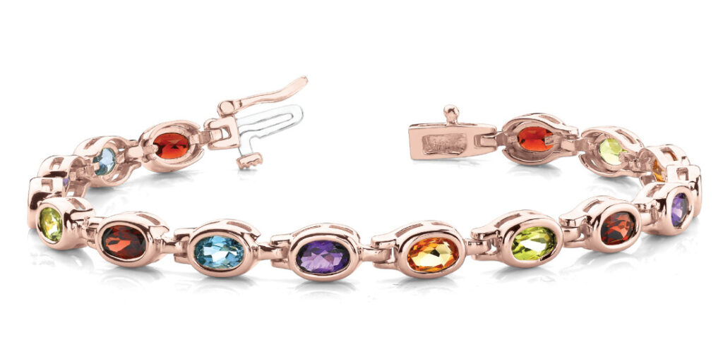 A vibrant and eye-catching bracelet featuring a rainbow of gemstones, creating a stunning piece of jewelry.