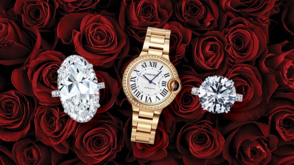 A luxury watch and two diamond rings nestled amongst a bed of velvety red roses.