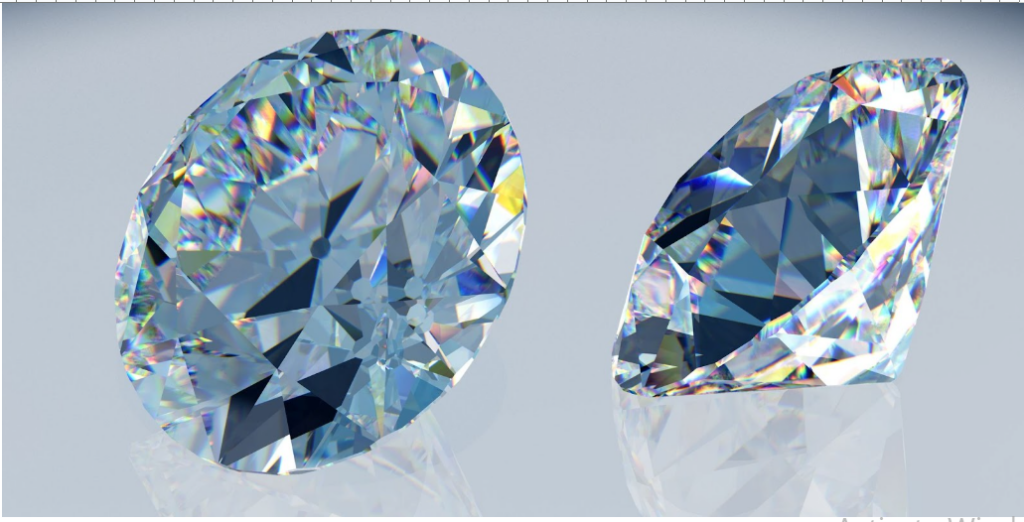 Two sparkling diamonds, one oval and one round, with a bluish tint, displayed on a light gray, reflective surface.